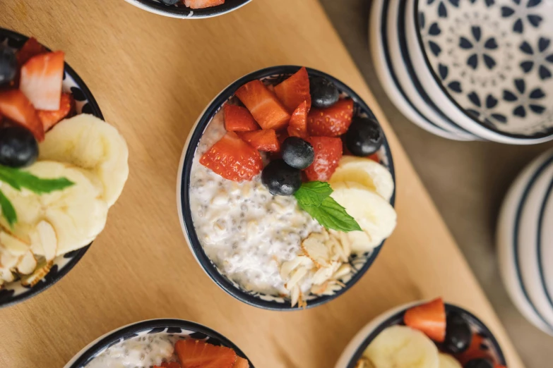 fruit and yogurt topped with nuts in a bowl