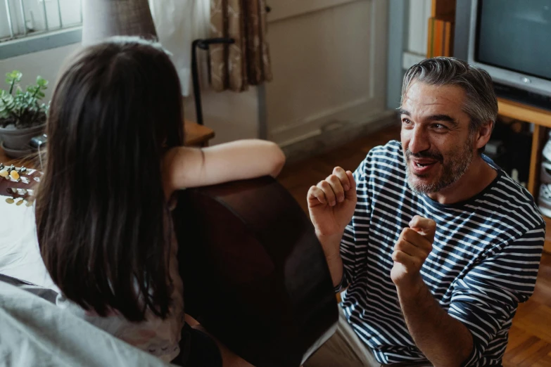 the man and woman are talking and having a conversation