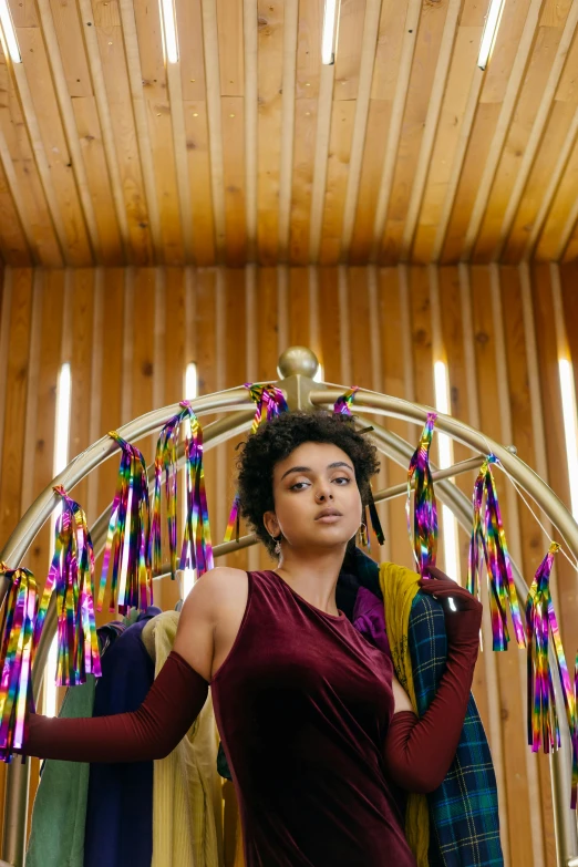 an indian woman hangs some ribbons on her rack