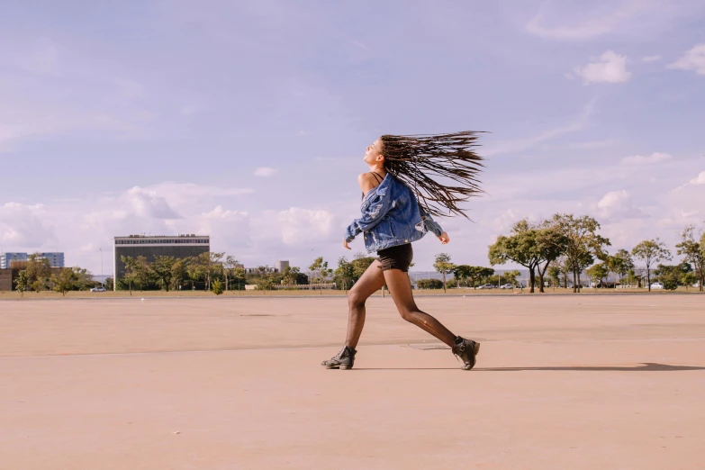 a girl with long hair is on the street