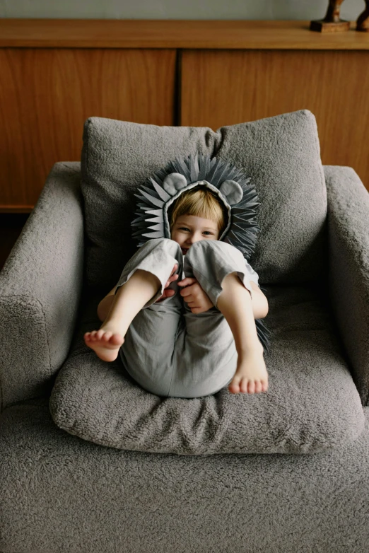 a  sitting in a big chair