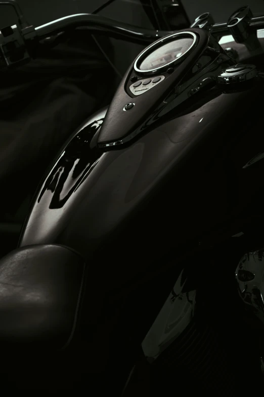 a close up po of the front seat and side handlebars on a motorcycle