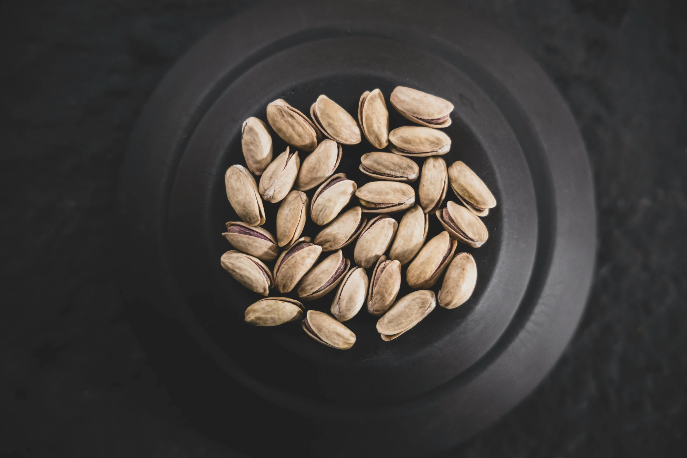 a plate with nuts sitting on it's sides