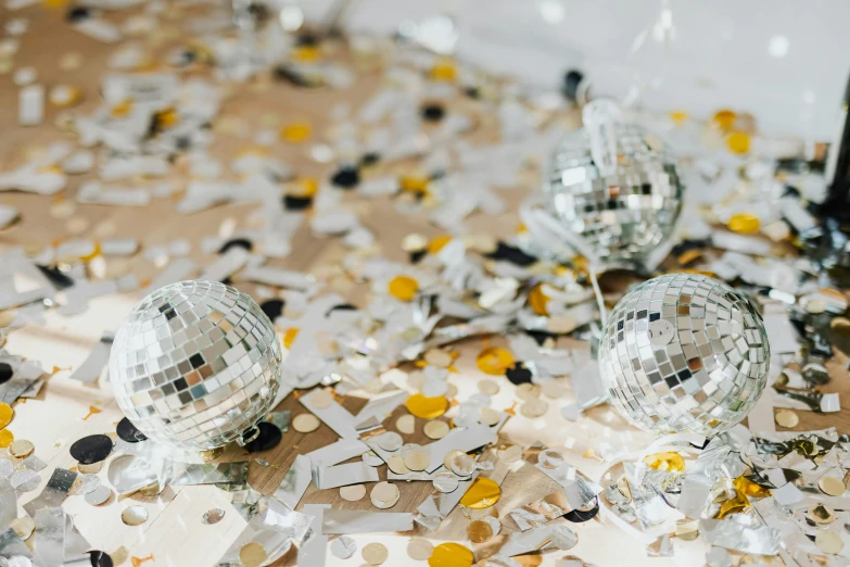 disco balls and confetti on a white background