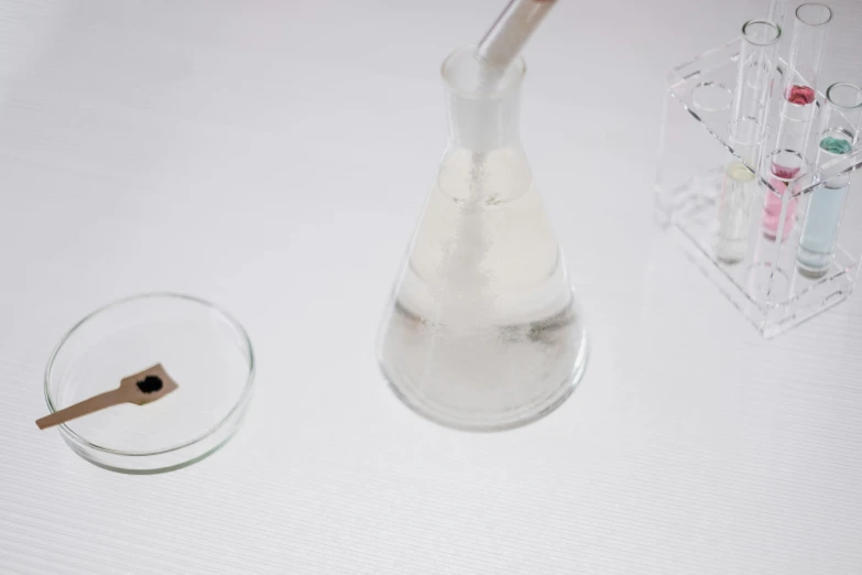 a glass tube filled with liquid on top of a table