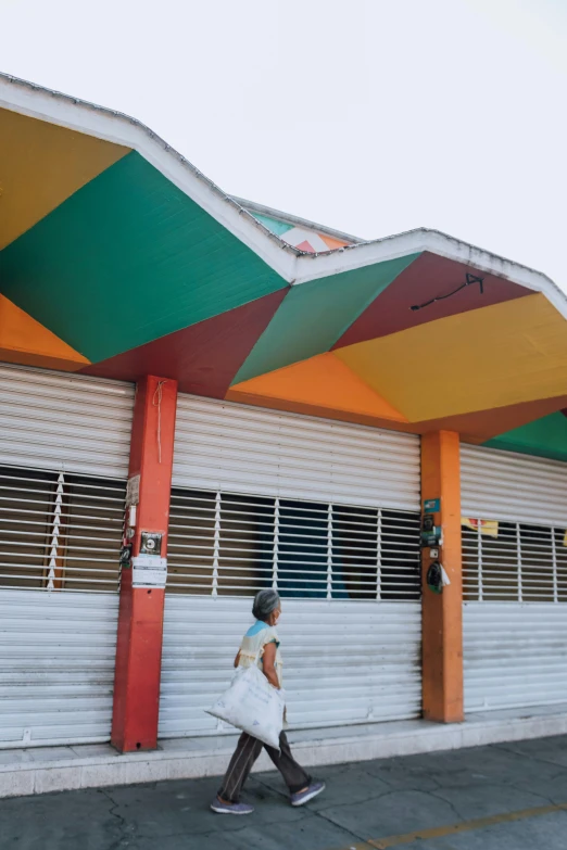 an orange and green colored canopy above the entrance