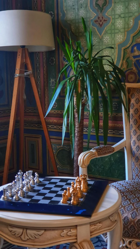 a chess game sitting on a small table in a room