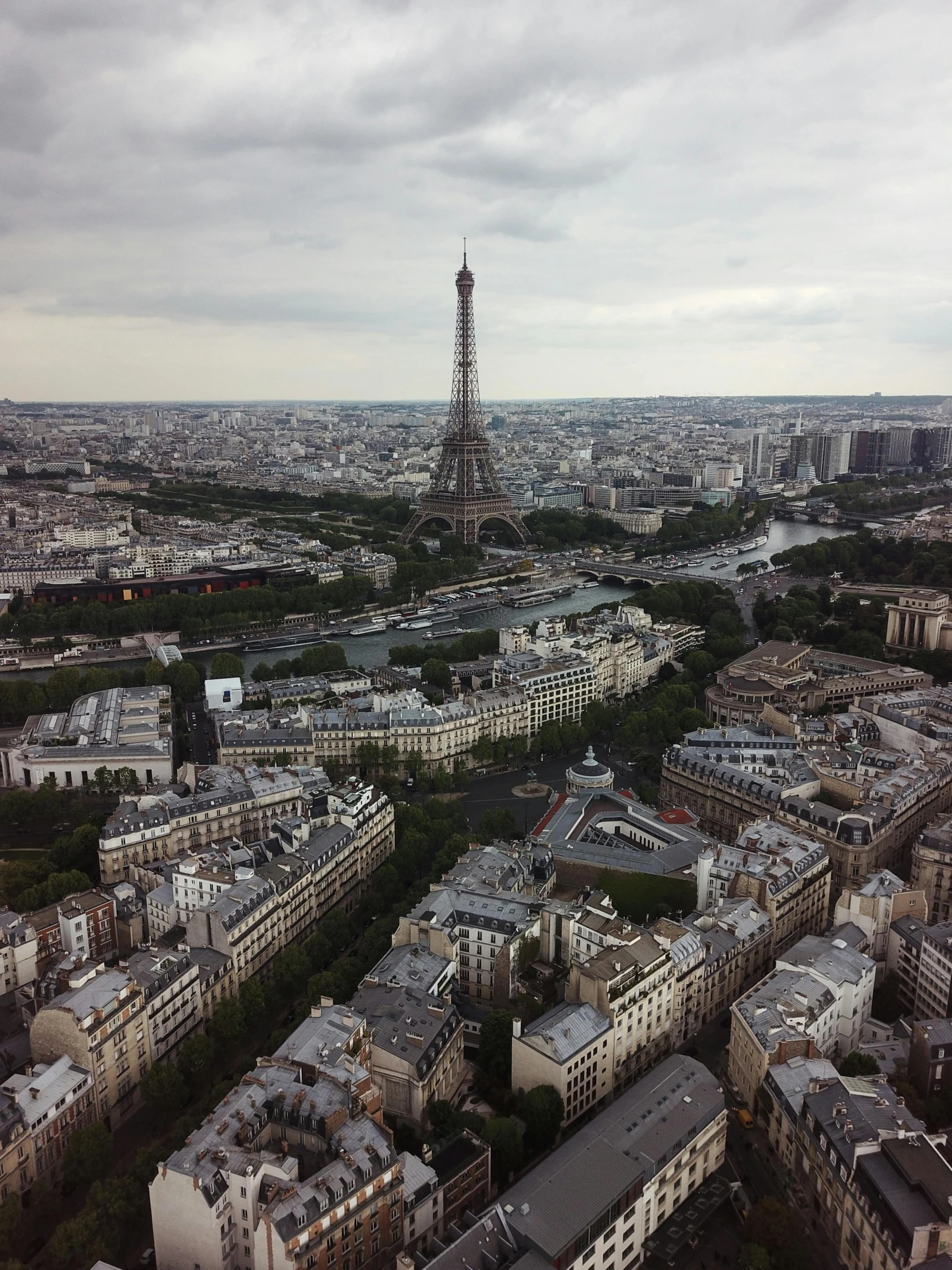 eiffel tower towering over paris from a distance