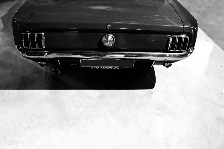 the front end of a mustang car sitting in a studio