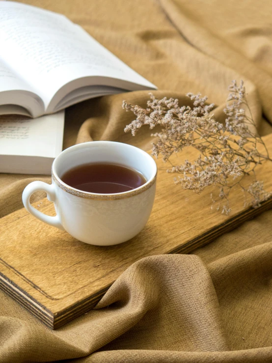 a book and a cup on a table