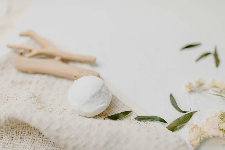 this is an image of a white towel with some shaving tools on it