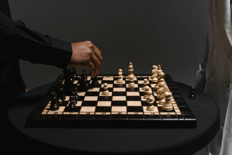 a man playing chess in the dark