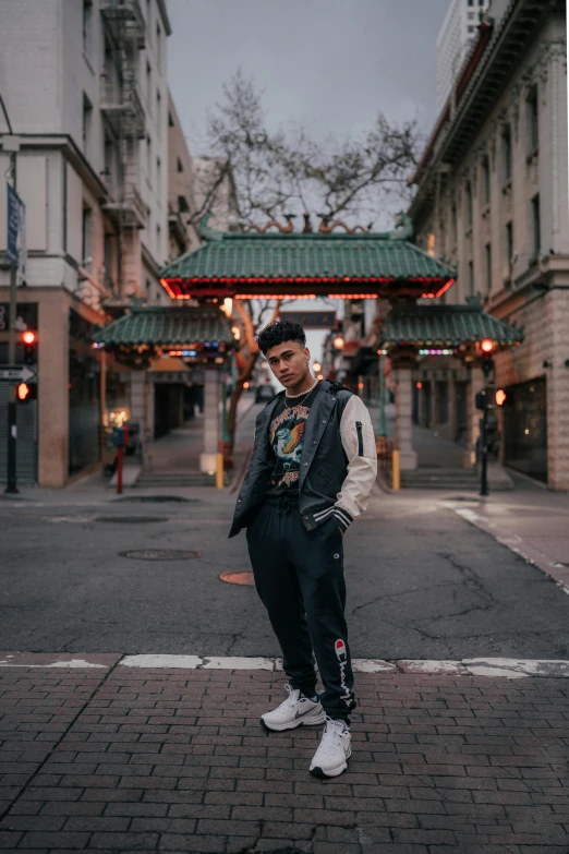 a man is standing in the middle of an empty street