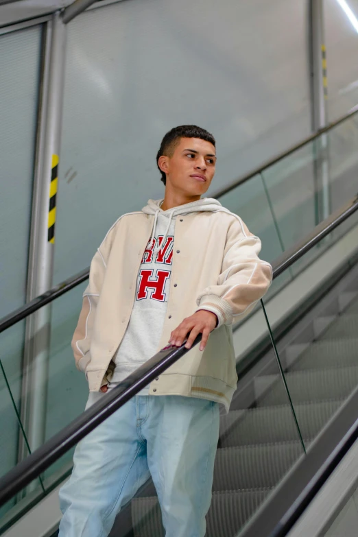 a young man riding an escalator in front of a camera