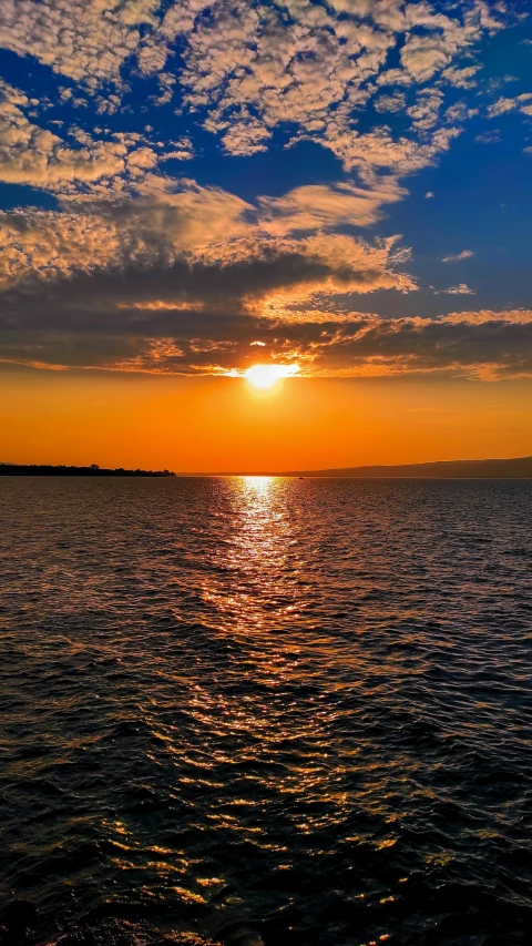 sunset over the ocean with very low clouds