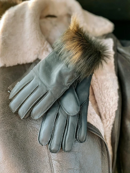 a glove that is on the jacket jacket