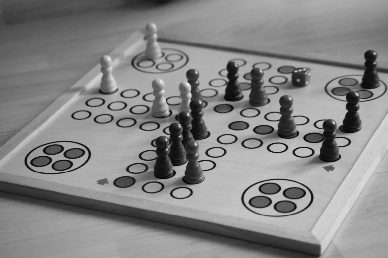 a chess board on the floor with black and white board