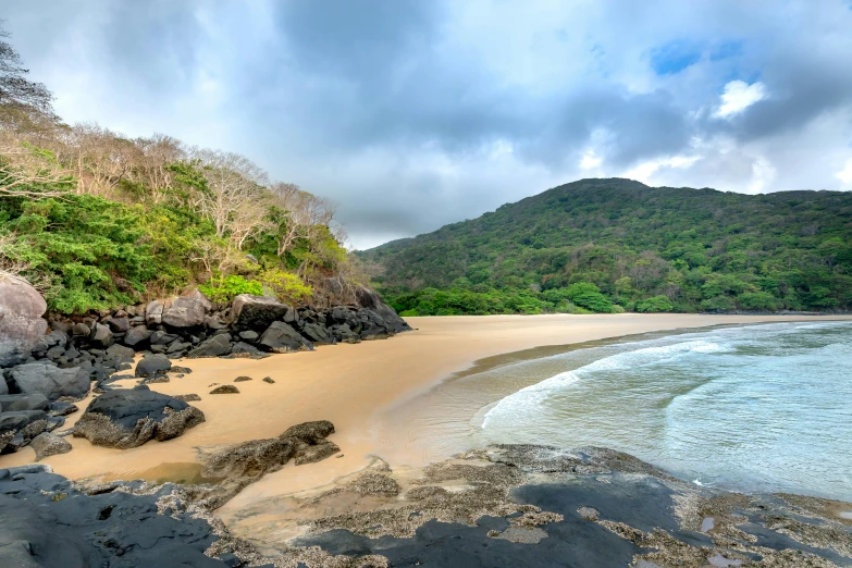 rocks and gravel on the shore of a beach