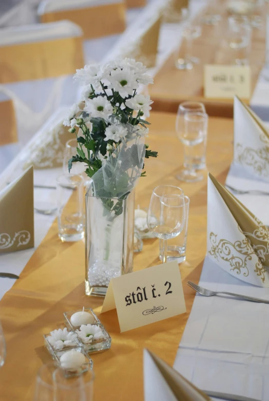 a wedding table set with floral centerpieces