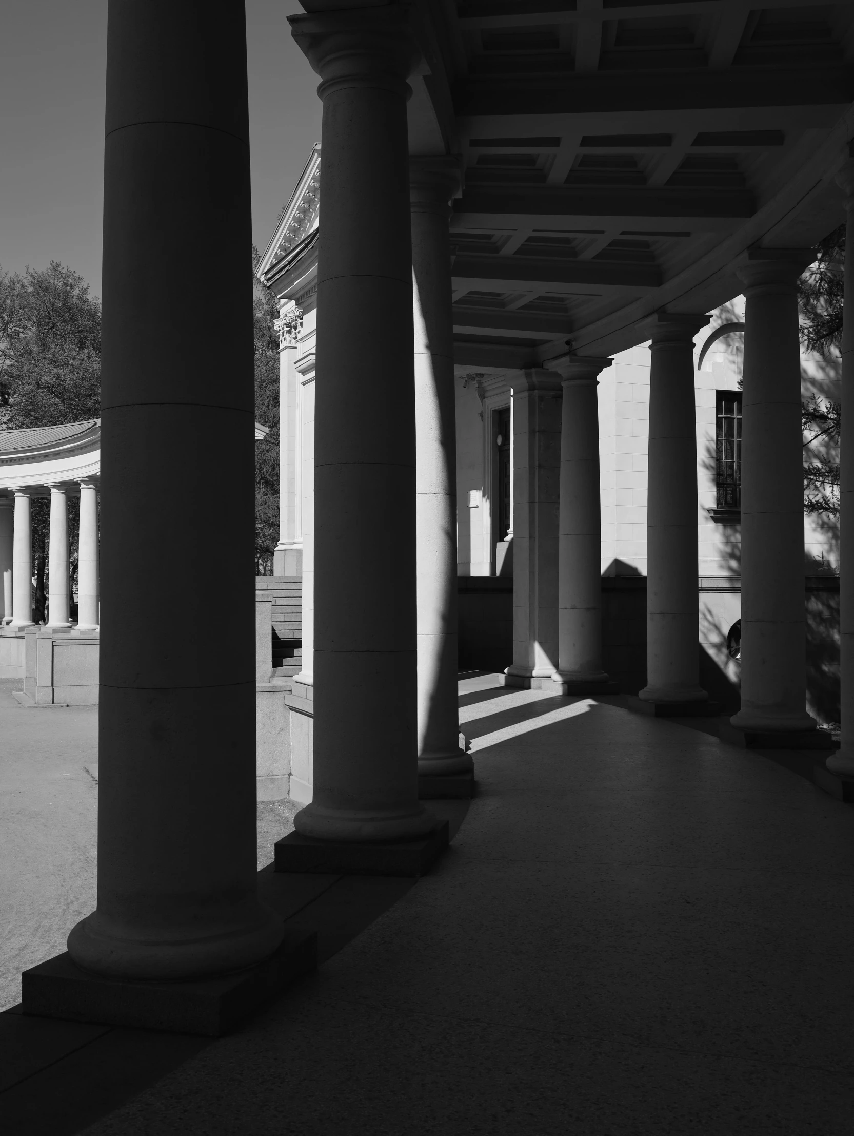 columns are on the floor of an outdoor walkway