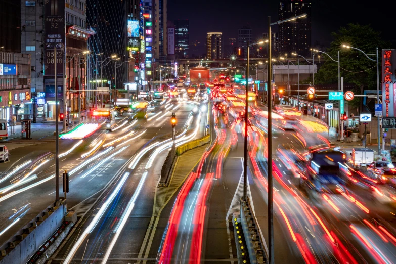 an image of a night time scene of city traffic