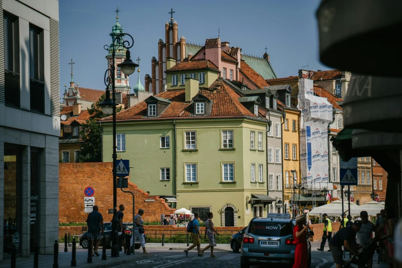 a group of people standing in a city street