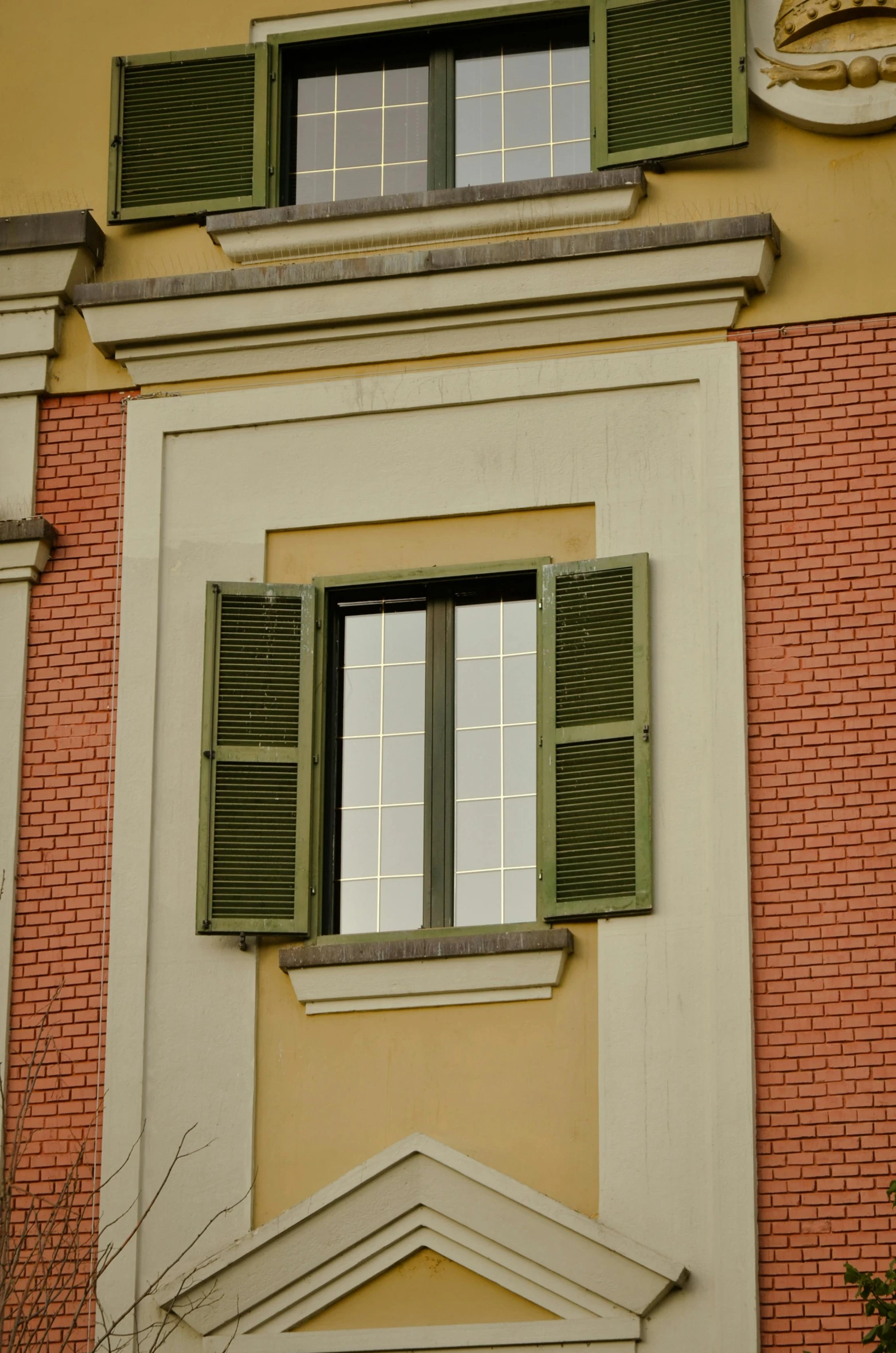 an old window in the front of an apartment building