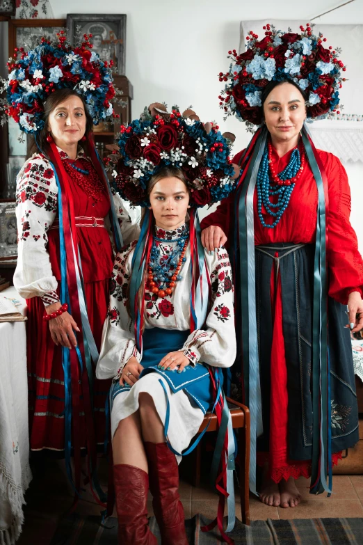 three women with flowers in their hair