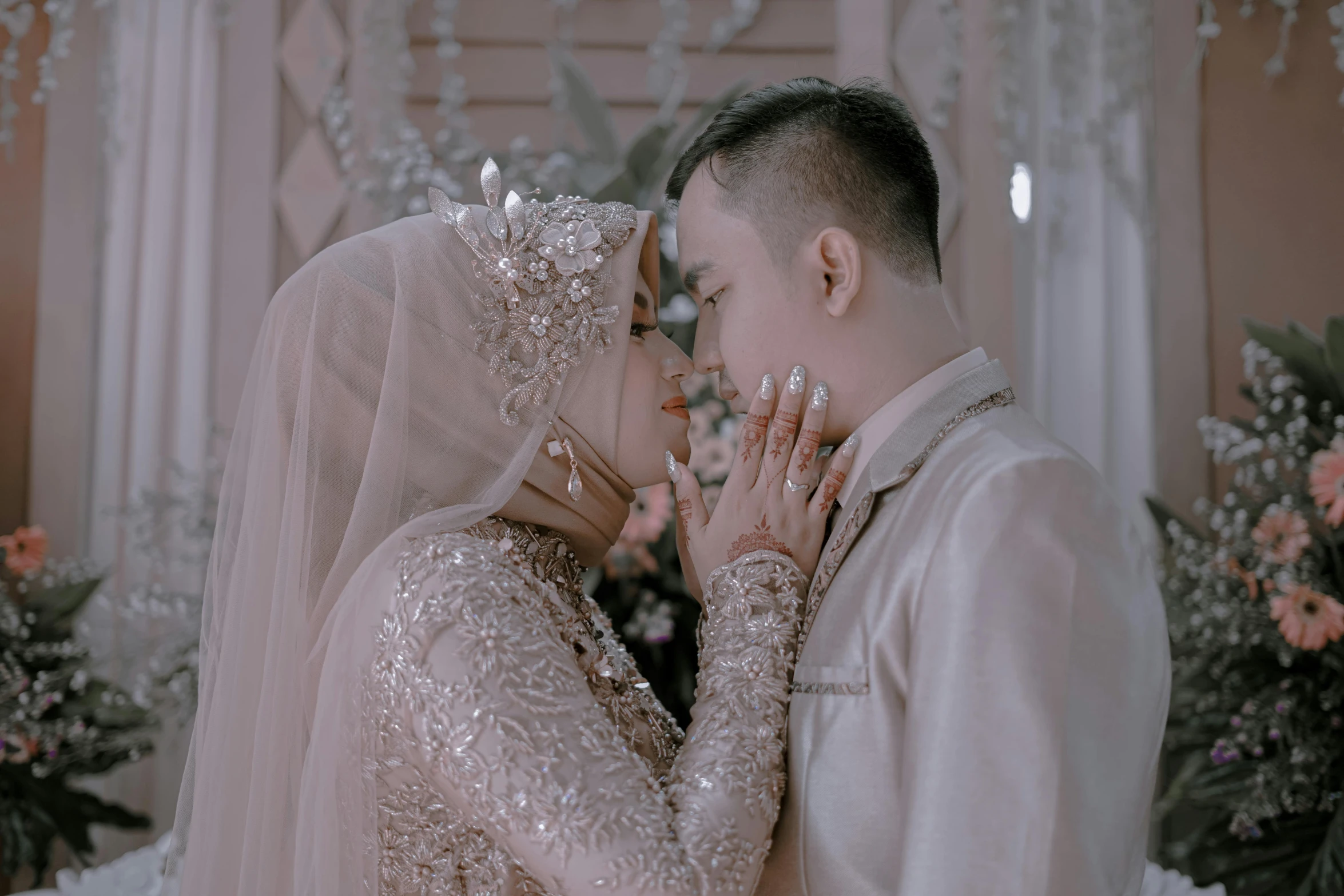 a newly married couple kissing each other in the midst of a wedding