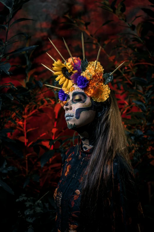 a person with makeup and flowers in their hair