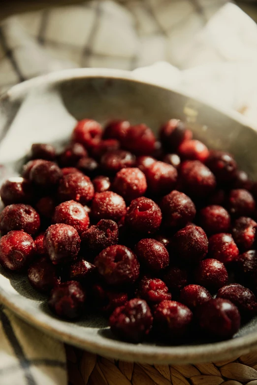 a metal bowl filled with lots of fruit