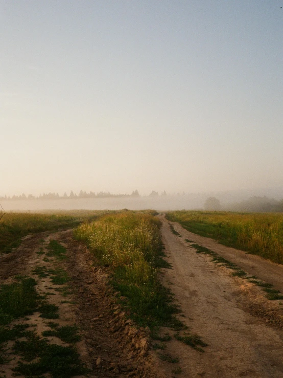 a dirt road that has no traffic sign on it