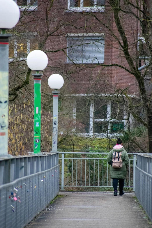 a person that is walking on a bridge