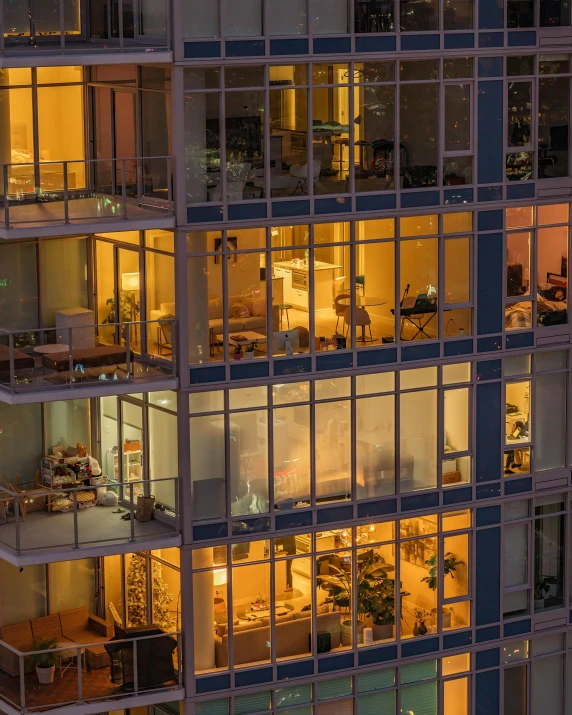 an apartment building is illuminated up with windows