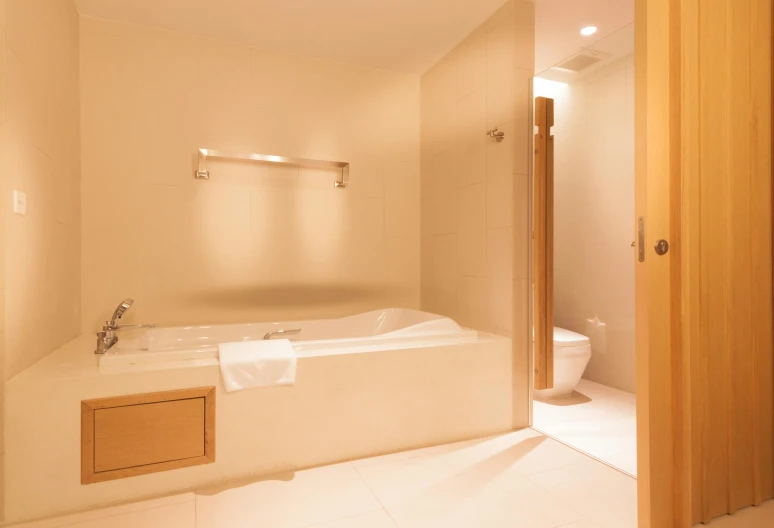 an inside view of a bathroom with a white bathtub