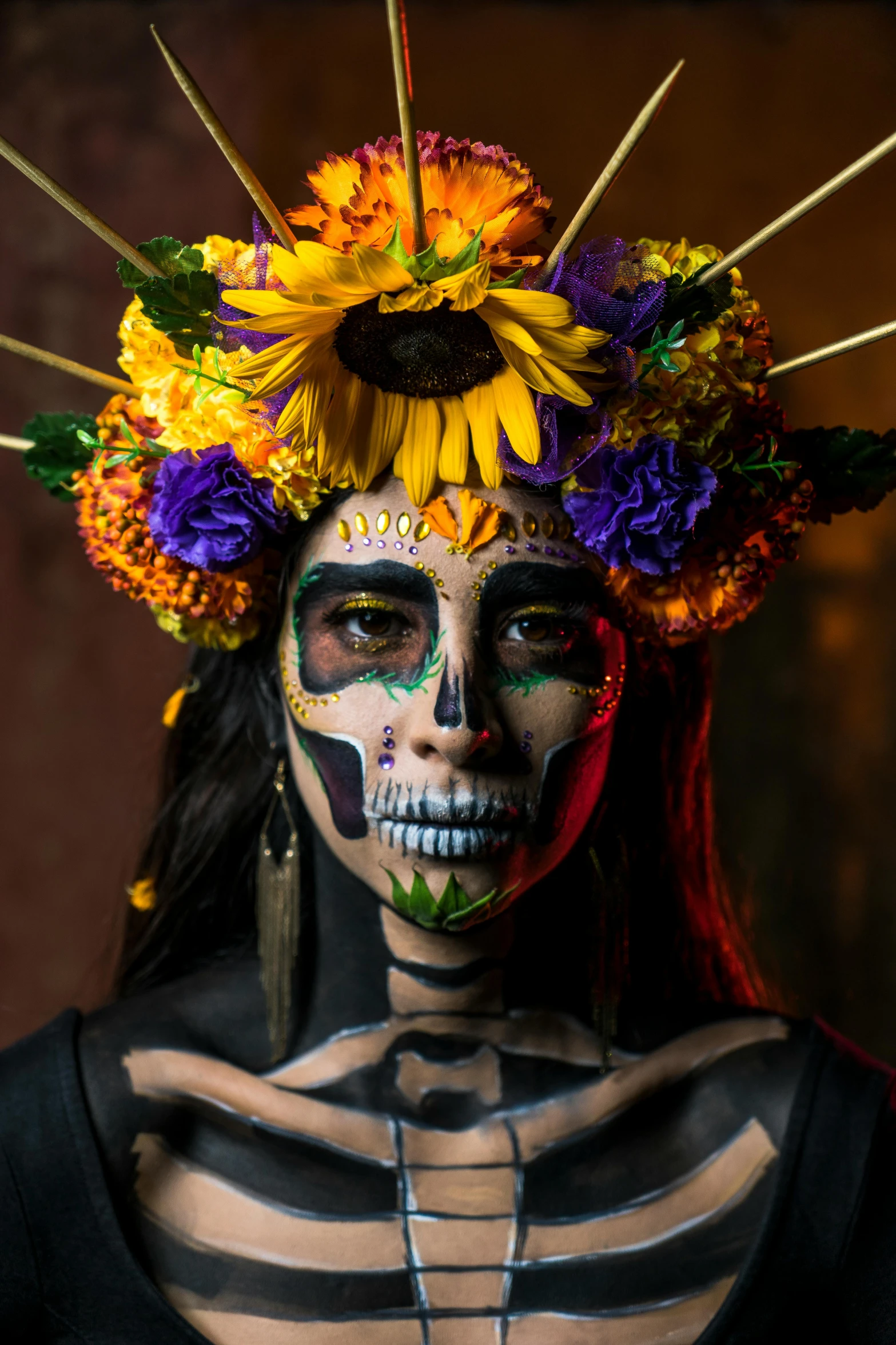 woman with face painting and sunflower wreath