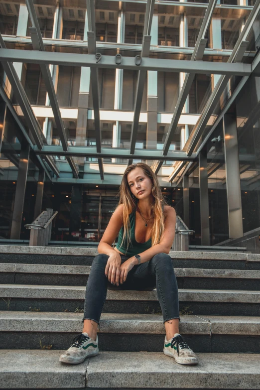 a women who is sitting on some stairs