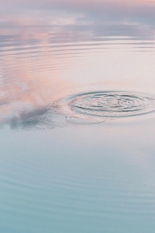 water splash with some interesting pink clouds in the background