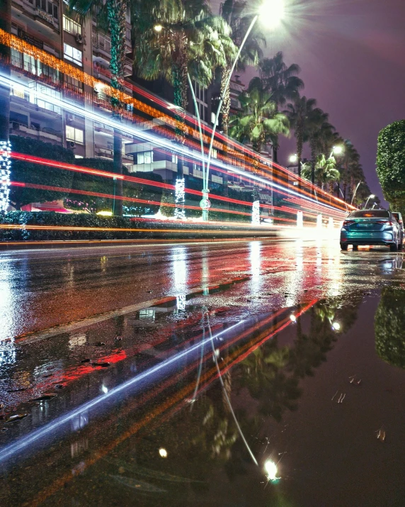 the street is lit up with many blurry lights