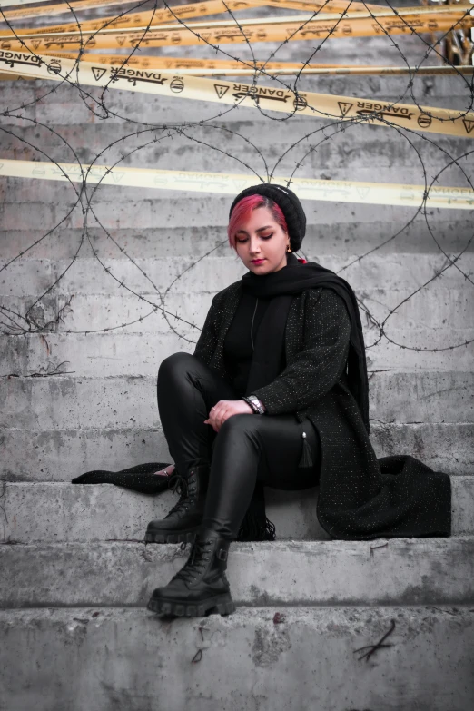 a woman with red hair and piercing head sitting on steps