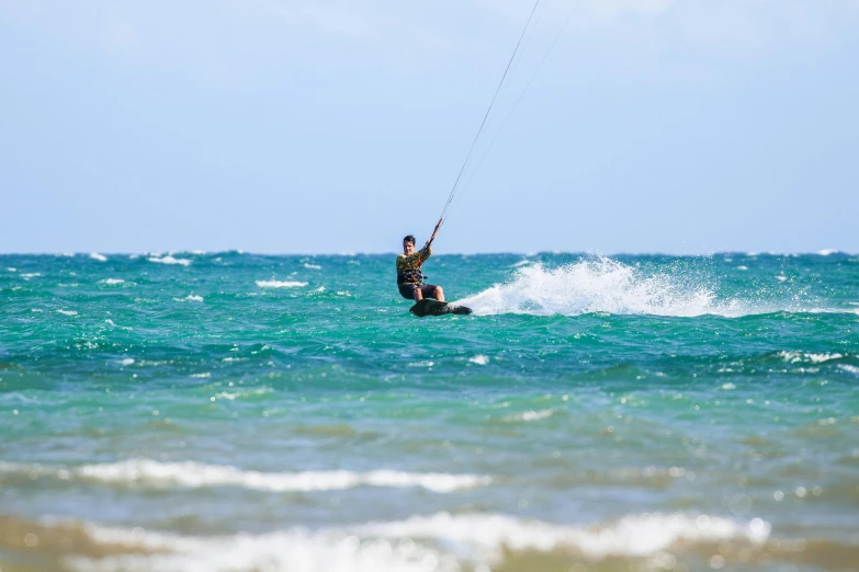 someone is riding their board on the water