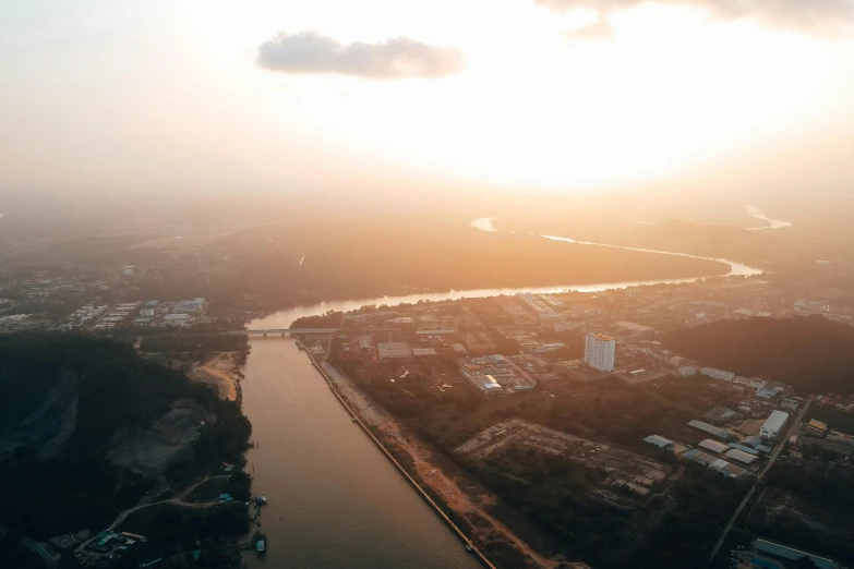 a river that runs through a lush green city