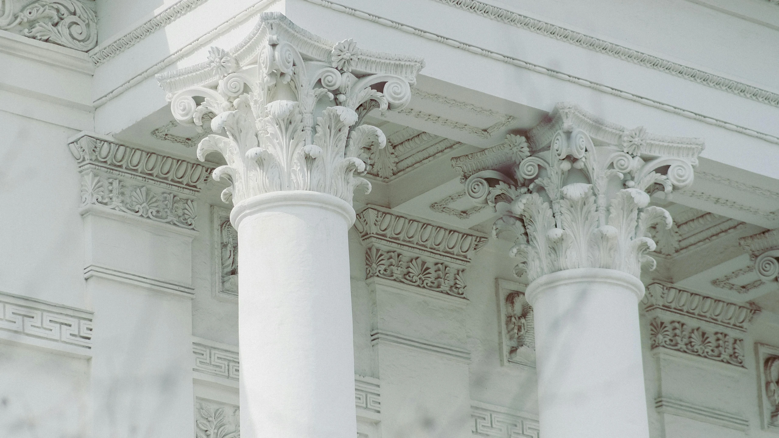 two pillars that are outside of a building