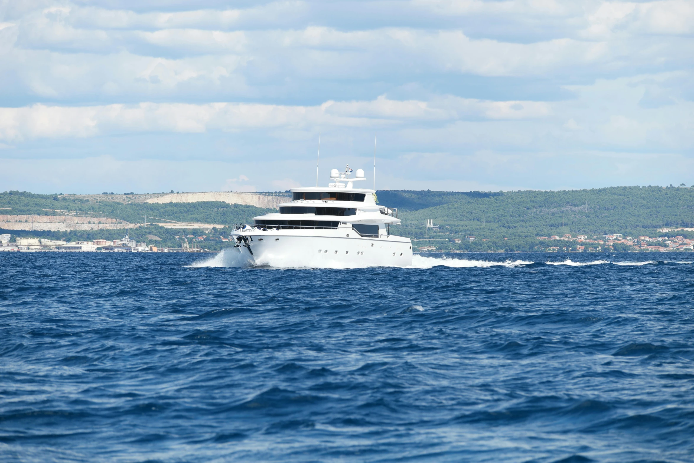 a boat sailing in the middle of the ocean