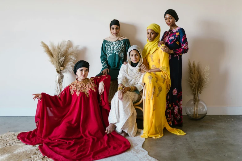 an image of some people posing in their ethnic clothes