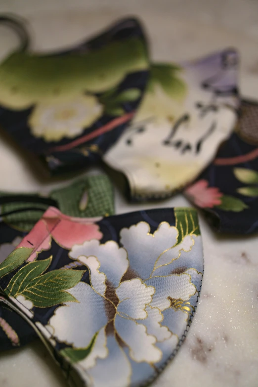 two small cloth flowers on a table