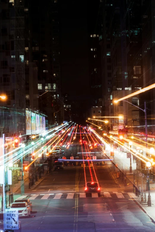 an urban street at night with streetlights and long exposure lights