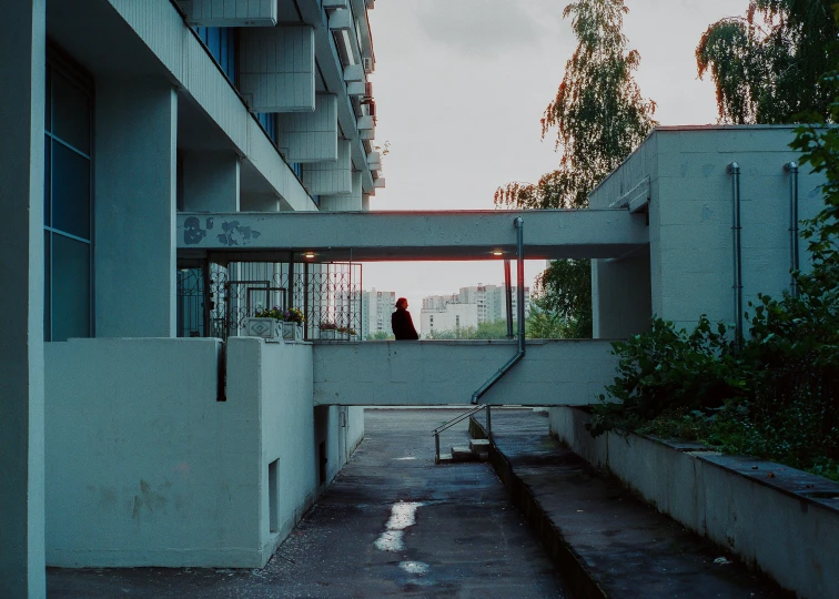 a woman is standing on some stairs inside a building