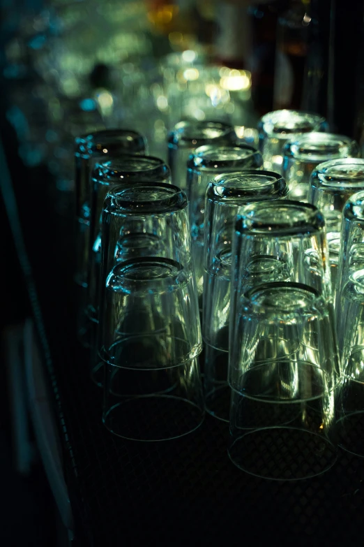 large glass drinking cups lined up together