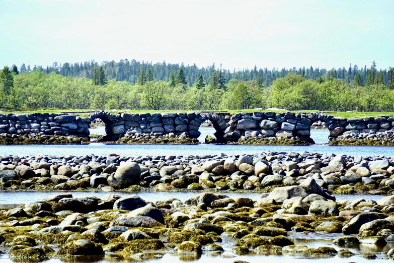 there is a rock bridge that has stones at the top